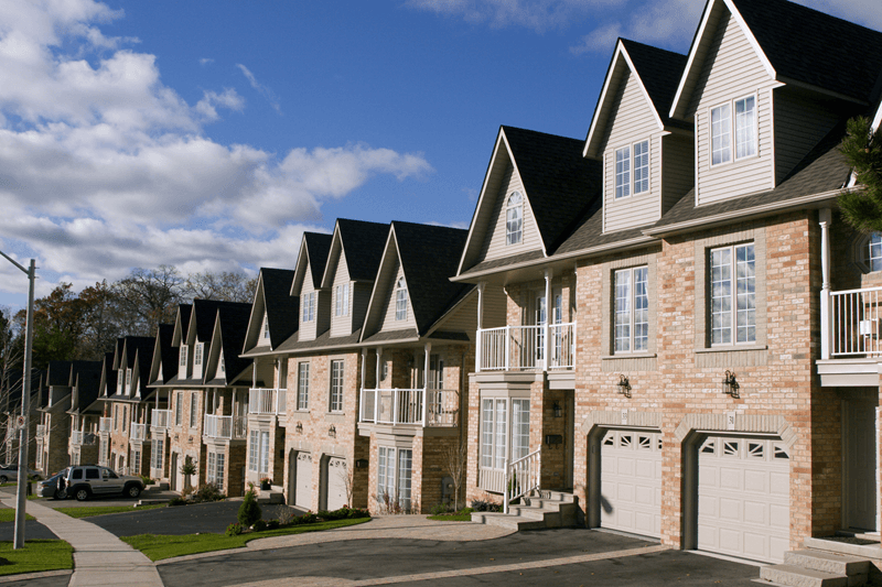 Neighborhood of light brick townhomes